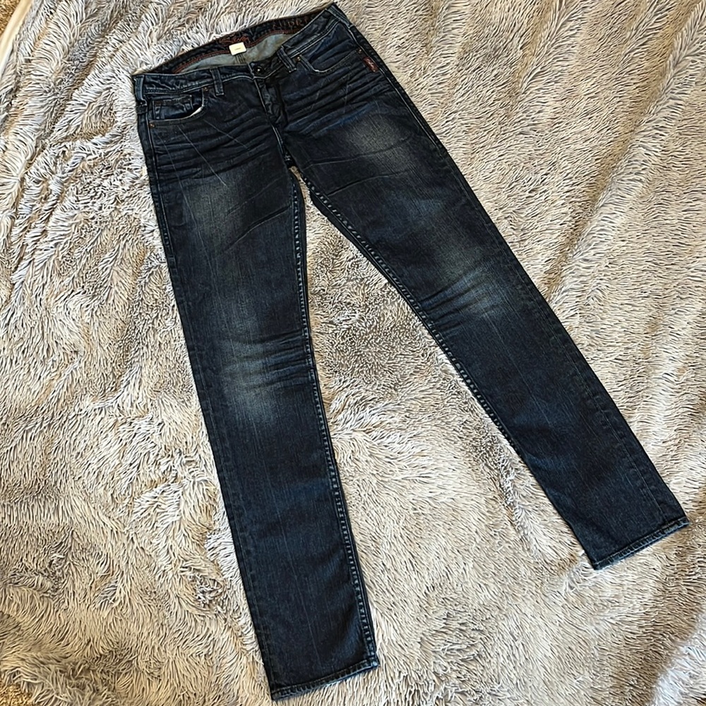 EUC silver skinny jeans in a dark, heathered wash.